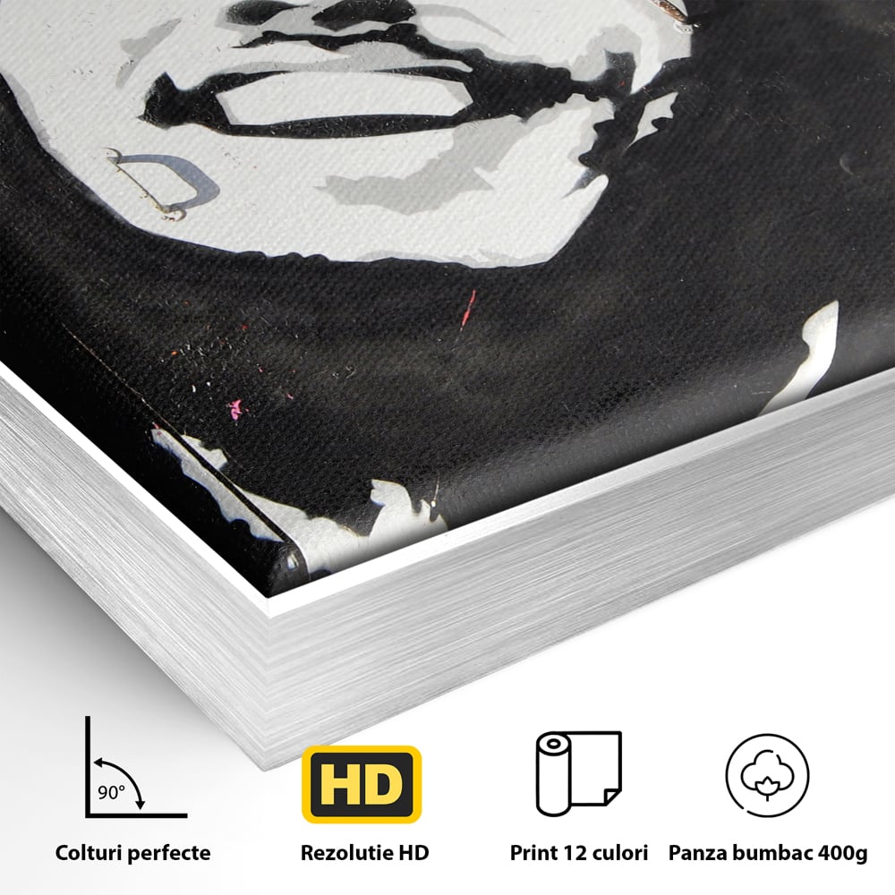 Detaliu al suprafetei: tablou pictat cu portretul lui bob marley, in rama de aluminiu argintiu